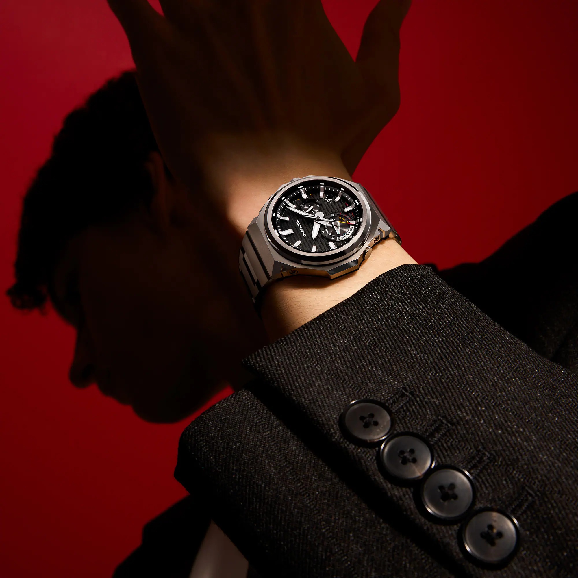 G-STEEL GST-B1000 worn on wrist with suit
